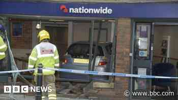 Car crashes through wall into town's bank branch