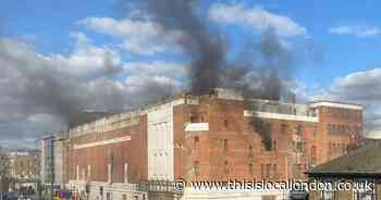 Firefighters tackle HUGE fire at abandoned historic Kingston building
