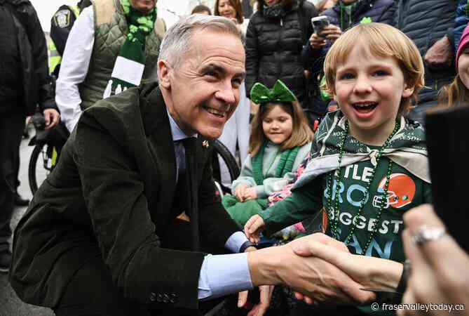 Prime Minister Mark Carney marches in Montreal’s St. Patrick’s Day parade celebration