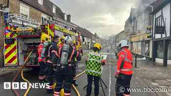 Road closed following convenience shop fire