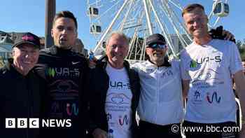Runners cross seven marathons finish line at pier
