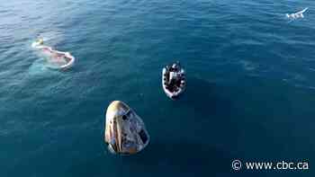 Astronauts splashdown on Earth after spending an unexpected 9 months in space