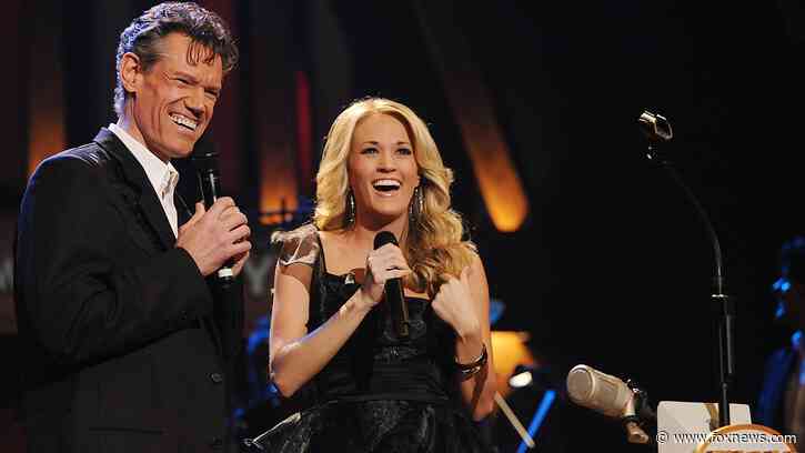 Carrie Underwood's tribute to Randy Travis moves Grand Ole Opry audience to tears