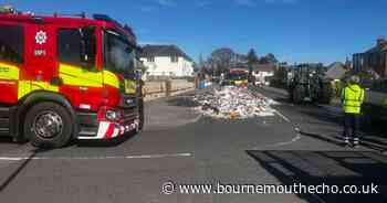Rubbish scattered across street following bin lorry fire