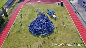 Drieduizend Genkse leerlingen vormen levende waterdruppel