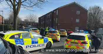 Man arrested after huge police presence descends on street in Warrington
