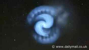 Mystery as huge spinning white spiral spotted in the skies above Britain