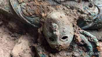 Huge Iron Age hoard is discovered in North Yorkshire: Archaeologists uncover over 800 ancient cauldrons, spears, chariots and horse harnesses thought to be worth £254,000