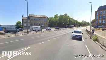 Woman dies after car crashes into road barrier