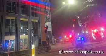 Live: Firefighters and police rush to 'smoking' building