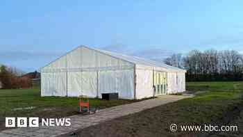 Pupils eating in tent a year after school closure