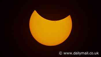 Rare 'devil horn' solar eclipse will be visible across the UK this weekend as the moon passes across the sun - here's the best time to see the spectacular display
