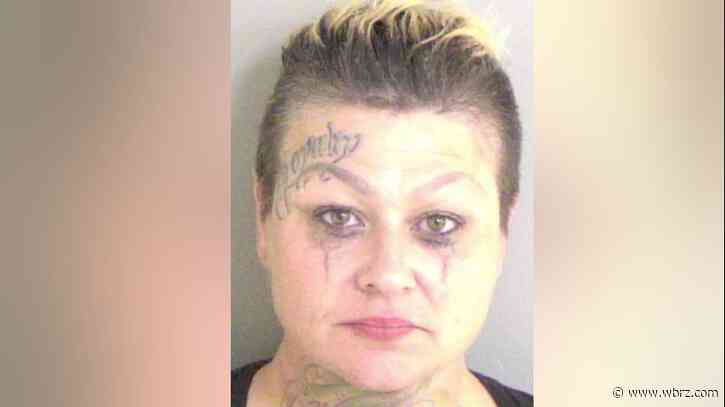 Woman arrested after allegedly trying to kill resident of camper by setting it on fire