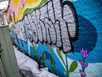 Two men arrested, third sought after 'beloved' mural defaced