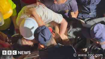 Watch: Moment rescuers pull woman alive from rubble