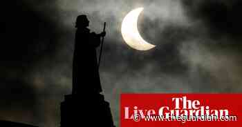 Partial solar eclipse: moon blocks part of sun for people in northern hemisphere – as it happened