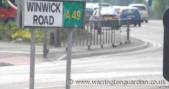 Traffic lights on major road in Warrington knocked down after Range Rover crash