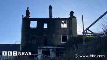 Woman arrested in pub arson inquiry