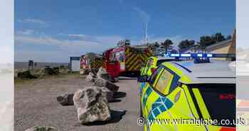 Two people and three dogs trapped in deep mud on Wirral beach in rising tide
