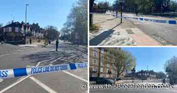 Pictures from Holloway double stabbing scene as large stretches of road shut off
