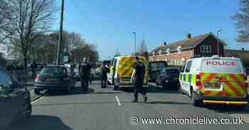 School in lockdown after teacher attacked with police called to scene and children in tears