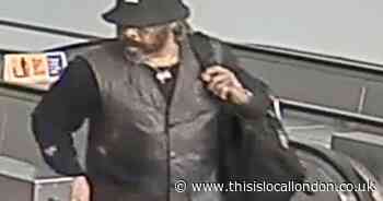 Picture of man released after victim thrown down escalator and kicked in Bank tube