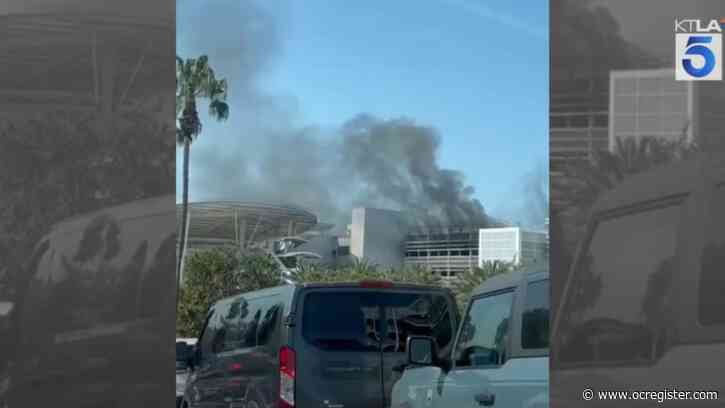 Car fire spreads in Disneyland parking structure