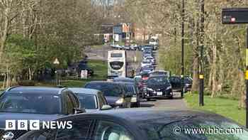 Mile-long queue at mobile waste collection site