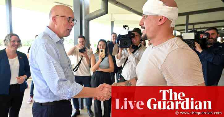 Cameraman injured after football kick; PM visits flood-hit Queensland – as it happened