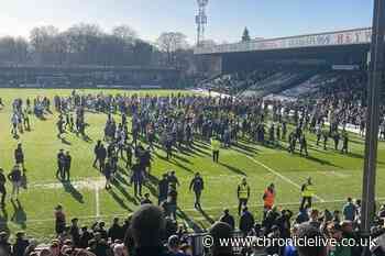 Parents 'cover children's eyes' as football match ends in chaos and fans invade pitch
