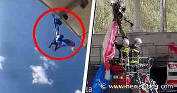 Parachutist zit vast aan dak van rugbystadion