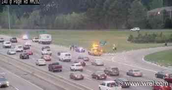 Spilled mail on side of I-40 slows traffic near Page Road in Durham