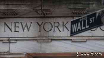 US stocks end slightly lower after turbulent session