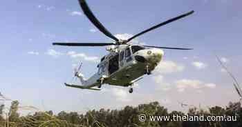 Injured man freed after spending night trapped under tractor on property