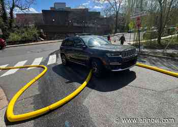 Arlington driver cited for driving SUV over fire hose