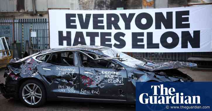 Sledgehammer-wielding Musk critics smash up Tesla in London art project