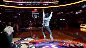 #TheMoment a Raptors fan nailed an almost impossible half-court shot