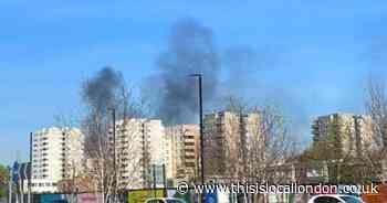 Major road closed after car crashes and catches fire in Thamesmead