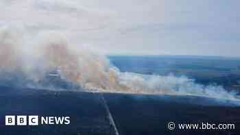 Wildfire battles continue with 'extreme' warning in place