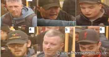 Football fans wanted after two men headbutted in racist assault on Tube train