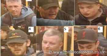 Football fans wanted after two men headbutted in racist assault on Tube train
