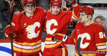 Flames beat the Sharks 5-2, to bolster late playoff push