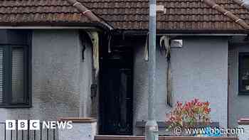 Houses firebombed as police condemn 'cowardly' attacks in gang feud