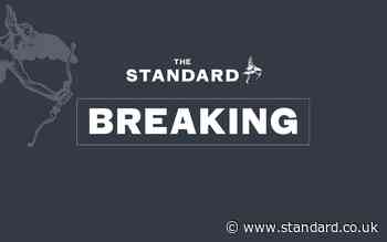 Scaffolding collapses in high winds  'trapping driver' on busy Hackney street