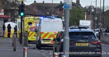 LIVE as yellow tent erected with cordons in place at bus stop in Dagenham