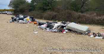 Multiple rubbish bags and mattress dumped at car park