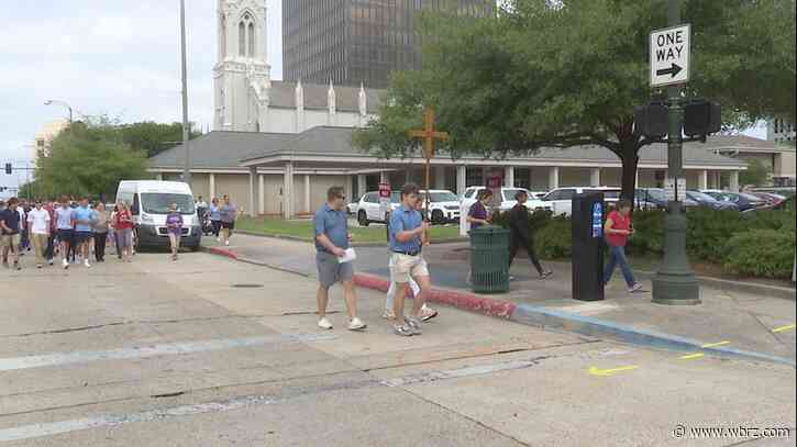 Catholics walk the stations of the cross through downtown Baton Rouge