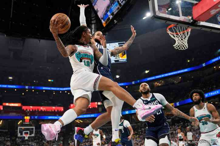 Grizzlies top Mavericks, Heat outlast Hawks to earn last 2 playoff spots