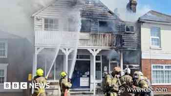 Crews try to save artefacts from sailing club fire