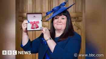 'My proudest day', says solicitor on collecting MBE